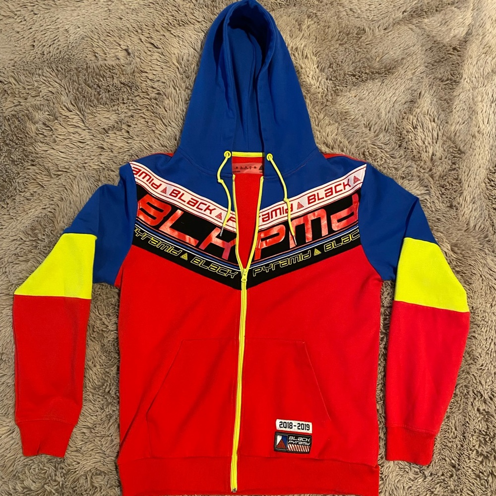 Mens Black Pyramid jacket size L used Chris brown brand full zip red blue yellow
